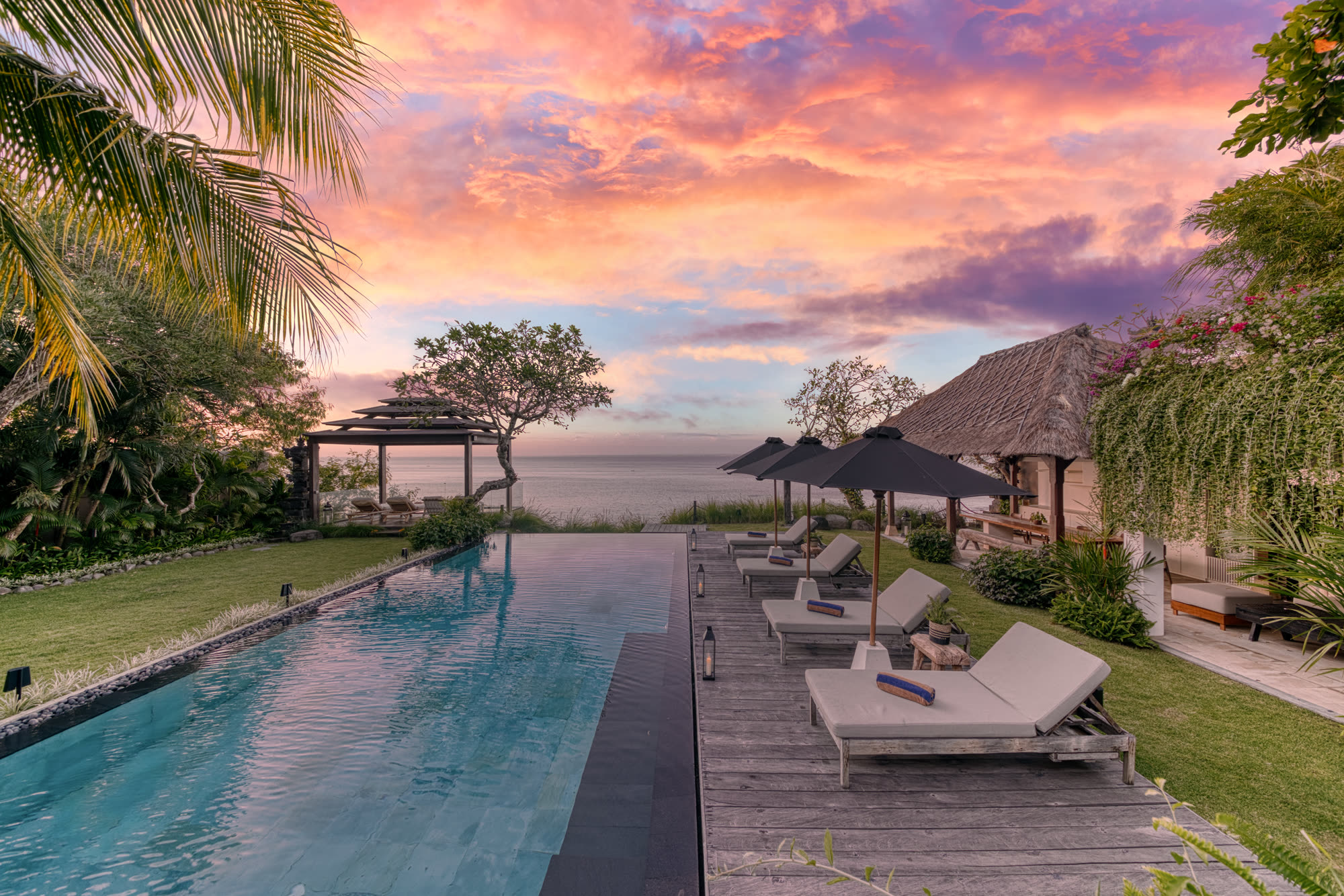 The pool and cliff bale under a sunset sky