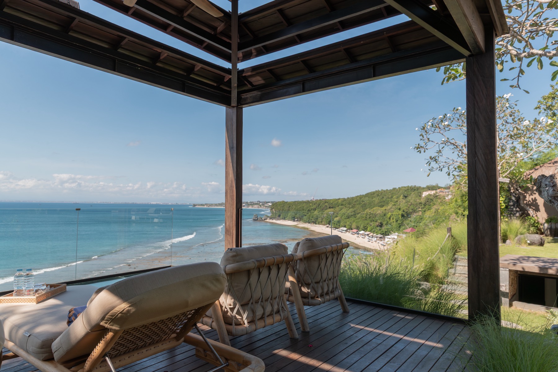 Cliff terrace loungers above the beach