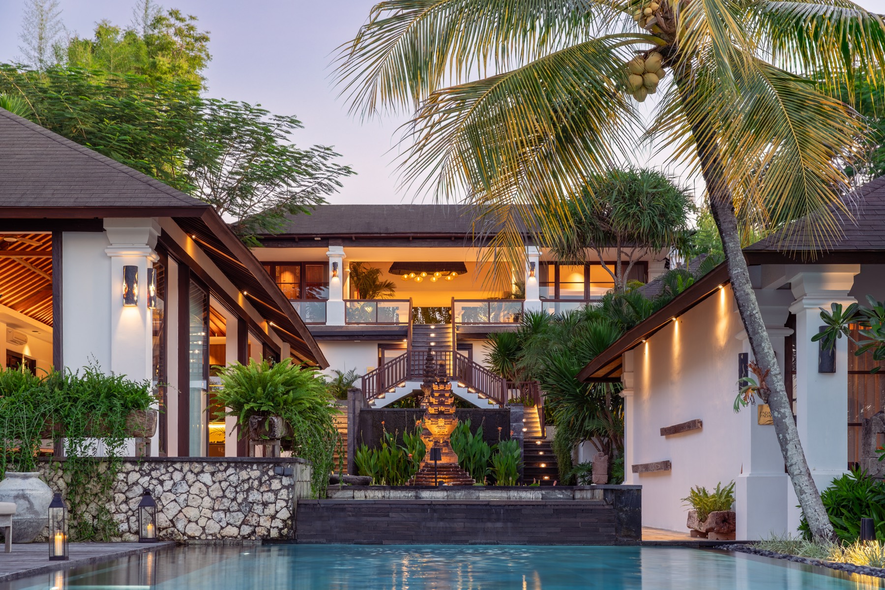 Villa staircase and pool at dusk