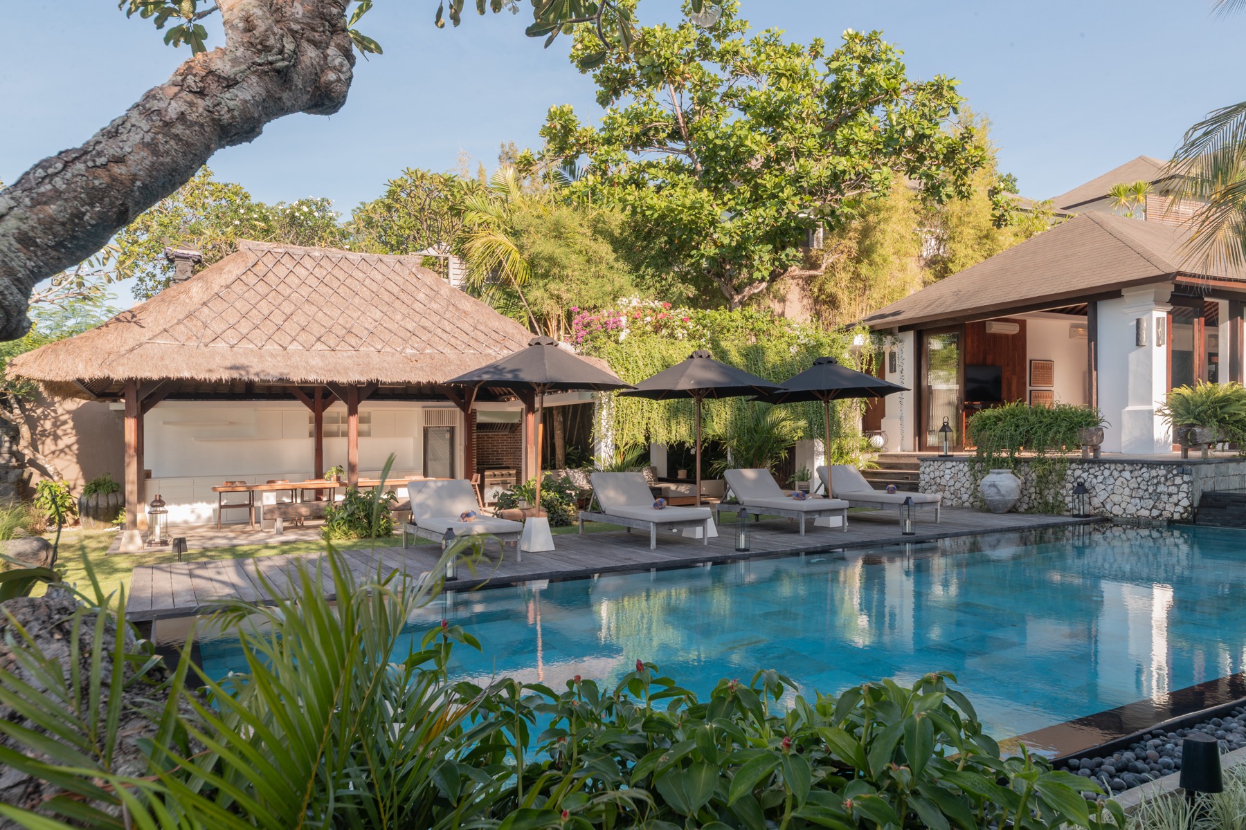 Garden pool with sun loungers